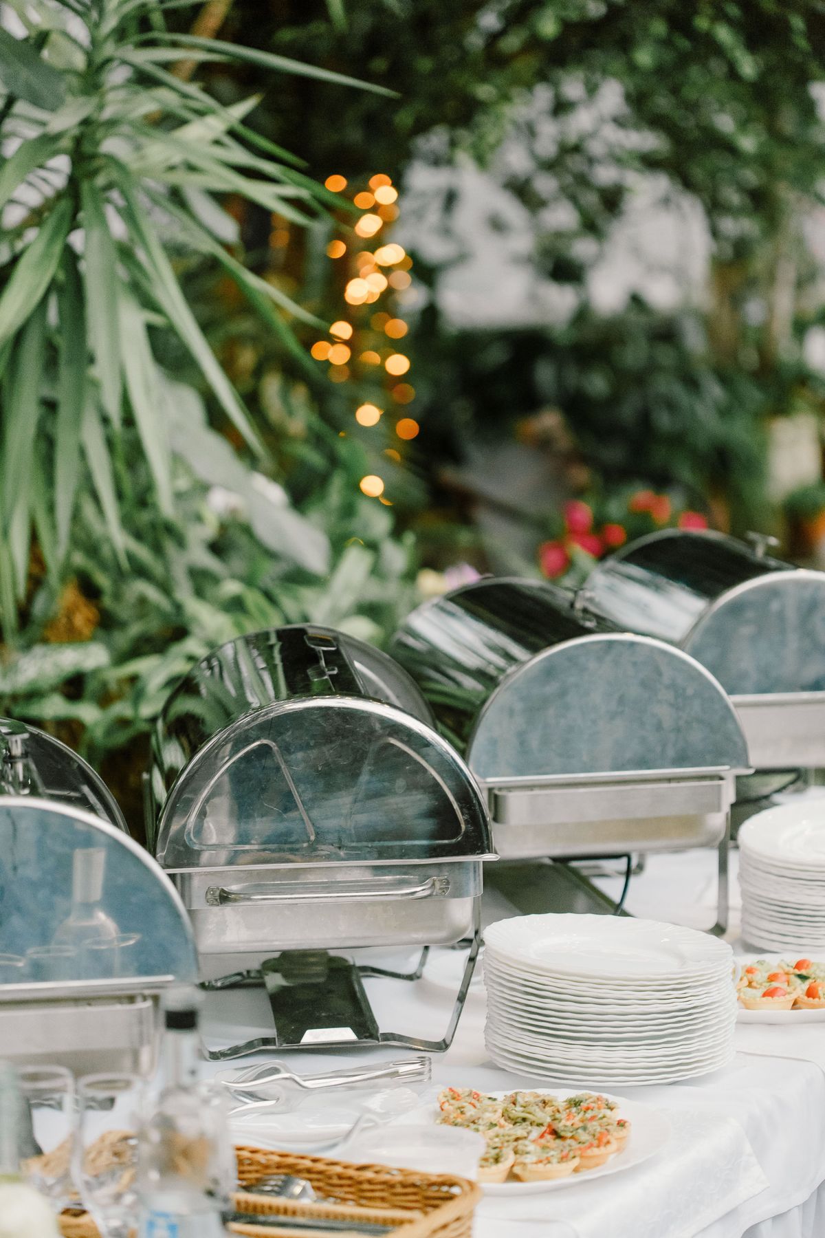 Floral arrangements and candle centerpieces on reception tables