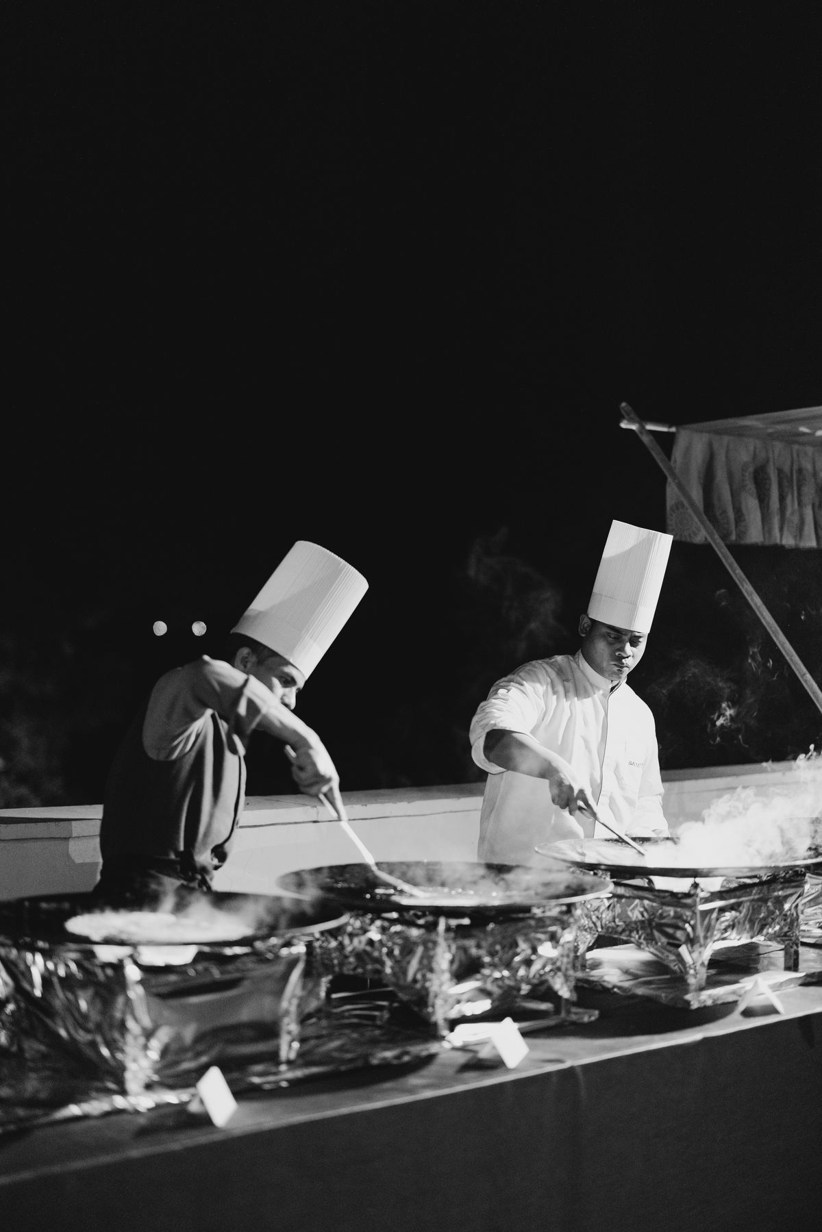Chefs preparing dinner at wedding reception