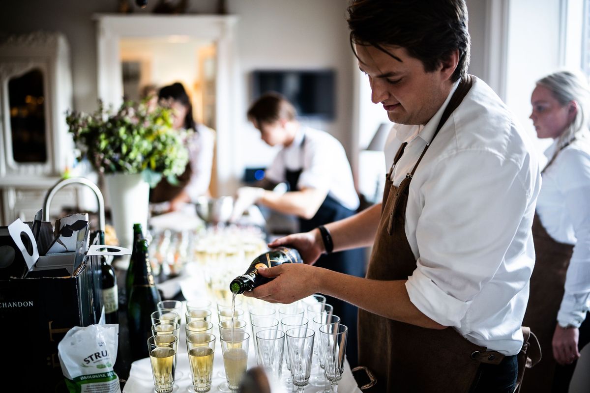 Bartender pouring drinks for wedding reception