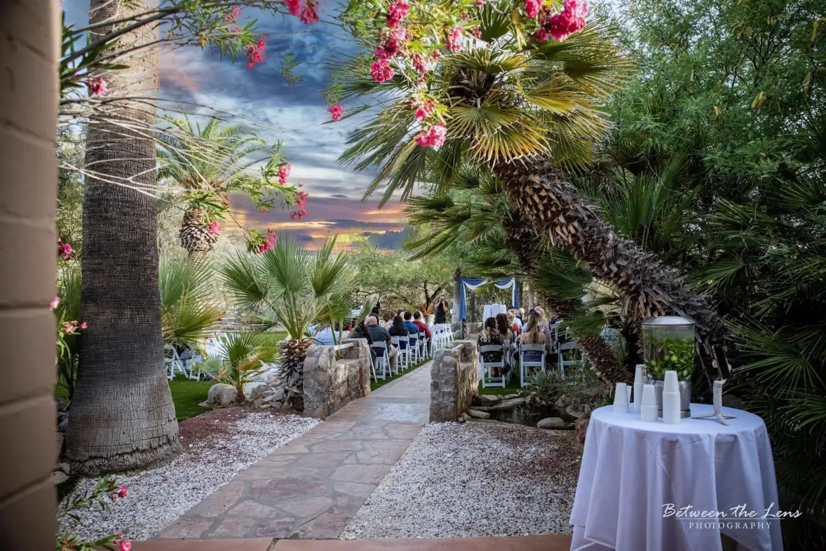 Wedding altar decorated with blooming flowers at Desert Bloom Estates, Tucson AZ venue decor