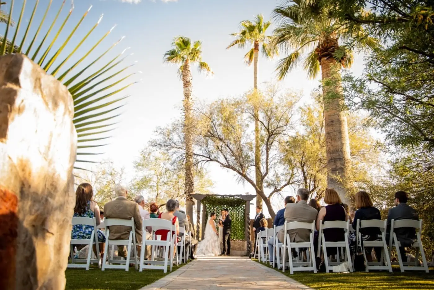 Golden hour wedding ceremony at Desert Bloom Estates, Tucson wedding vendors guide